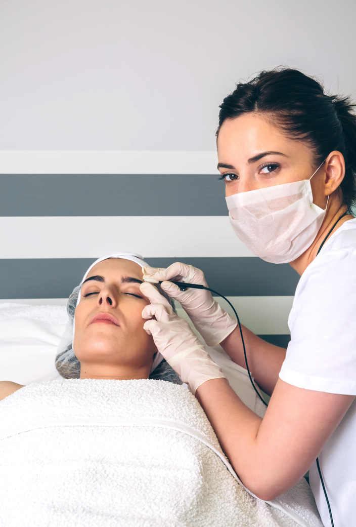 Female Doctor Doing Getting Rf Lifting to Woman in Clinic